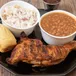 Slow-smoked BBQ chicken quarter with coleslaw, baked beans and cornbread at Bell's Breakaway