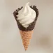 Vanilla soft serve in a chocolate-dipped waffle cone