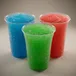 Blue raspberry, green apple and cherry slushy drinks in cups